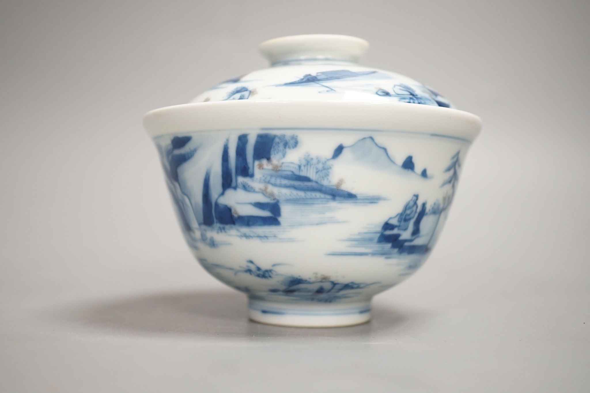 A Chinese underglaze blue and copper red bowl and cover, with hallmark, 9.5 cms high including cover.